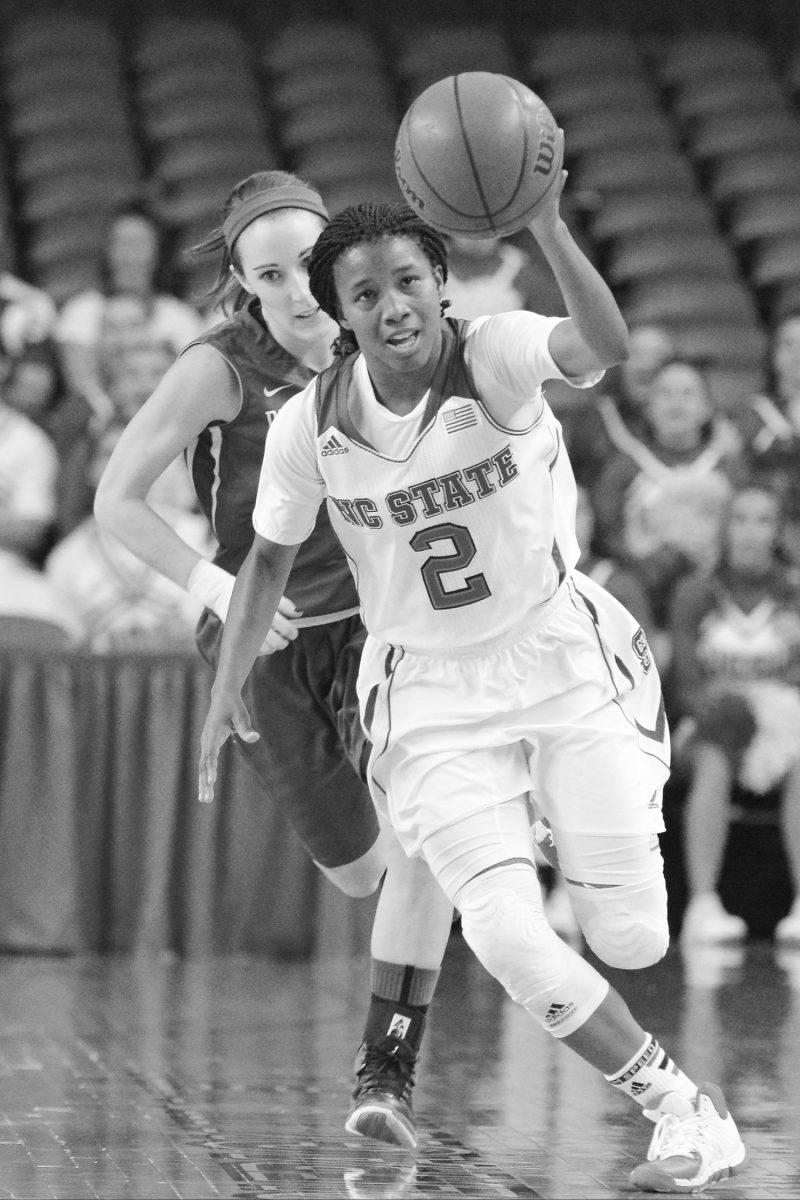 Redshirt junior guard Len'Nique Brown takes control of the ball during the game against Presbyterian in Reynolds Coliseum Saturday, Nov. 16, 2013. The Wolfpack defeated the Blue Hose 85-45. Photo by John Joyner.