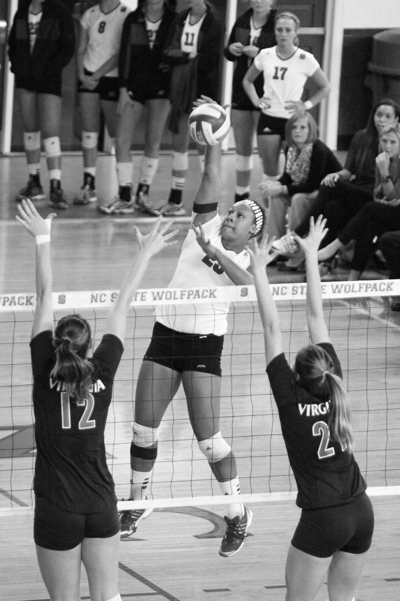 Junior outside hitter Dariyan Hopper spikes the ball against Virginia on Friday. Hopper had 18 kills against the Cavaliers, helping the Wolfpack to a 3-2 win.Photo By Eric Engstrom