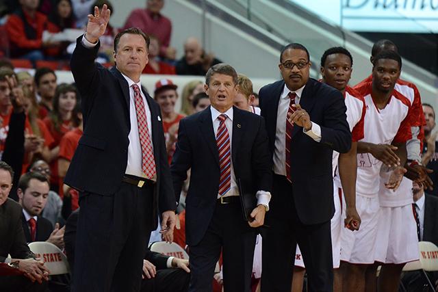 Head coach Mark Gottfried, associate head coach Bobby Lutz and assistant coach Orlando Early stand on the sideline calling out plays during the first half of the game against Appalachian State Friday, Nov. 8, 2013. The Wolfpack defeated the Mountaineers 98-77 at PNC Arena. Photo by Ryan Parry.