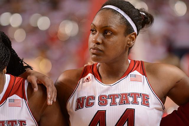 Senior forward Kody Burke stands with her teammates during the playing of the alma mater after the senior day game between No. 13 N.C. State and No. 2 Notre Dame in Reynolds Coliseum Sunday. The Wolfpack fell to the Fighting Irish, 84-60.&#160;