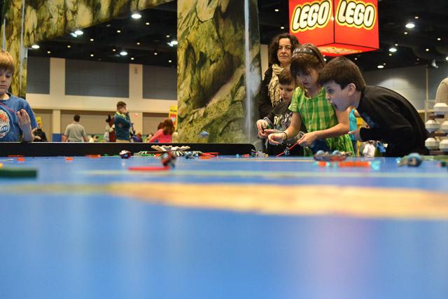Families and children assembled Saturday at the Raleigh Convention Center at the LEGO KidsFest. The LEGO Fest featured a LEGO Model Museum of characters from fiction. Also featured was a brick pile for children to dive in and put bricks together. Two LEGO Master Builders, Steve Gerling and Chris Steininger, were present to teach tools of the trade that they have learned through their years of building with LEGOs. Gerling and Steininger built most of the models displayed in the Model Museum. As visitors exited the LEGO Fest, they had the opportunity to build a section of the United States and have it placed on a 65 feet long by 45 feet wide. Visitors could view this visitor-made model from a balcony.