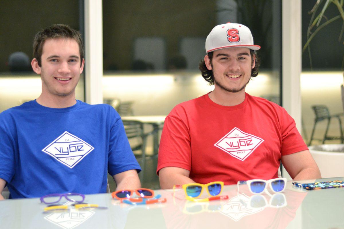 Chase Denison, a senior at Apex High School, and Kyle May, a sophomore in business administration, prepare for the pre-sale of their Vybe sunglasses this month, March 2014. The sunglasses can be completely customized with different colored frames, lenses, ear pieces, and side pieces. Denison started the design for these sunglasses a few years ago, and May joined him as a business partner. Photographed by Victoria Crocker.