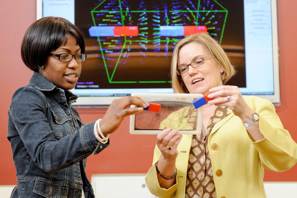 Gail Jones shows College of Education students how to work with hands-on materials.&#160;