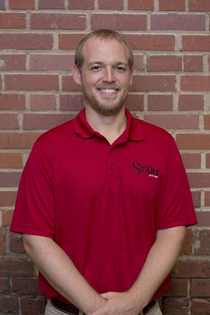 Owen Hooper, accelerated summer academic programs coordinator at the summer START program poses for a portrait inside Park Shops. Hooper plays a key role in guiding the START program in which incoming freshman take summer classes.