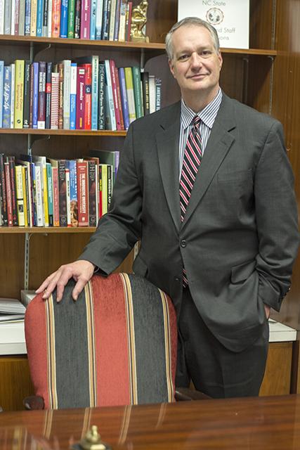Provost Warwick Arden poses in his office in Holladay Hall Tuesday afternoon. Arden has recently been promoted to interim senior vice president of academic affairs for the UNC-System.