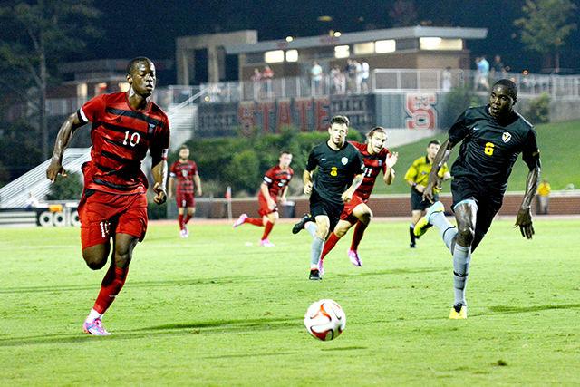 Freshman forward Ade Taiwo chases down a ball against Valparaiso&#8217;s sophomore defender Adrian Graham on Aug. 29 at the Dail Soccer Field in Raleigh. NC State and Valparaiso tied the game 0-0.