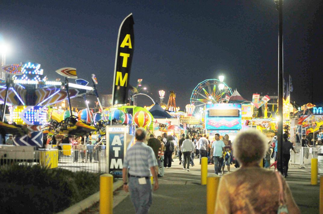 Rides, attractions, food stands, and fun houses light up at the annual State Fair in 2011. The fair opens this Thursday, and the concealed weapons ban will be upheld throughout its duration.