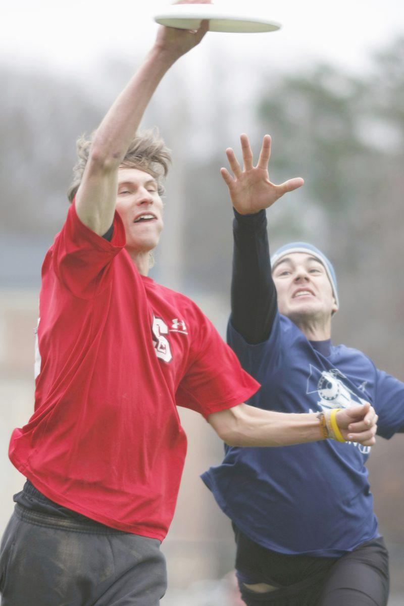 Scoring another point for the wolfpack, Brett Matzuka, a graduate student in biomathematics, 'skies' Brooks Taylor, a senior in biometrical engineering at the University of Virginia, in the Men's ACC Ultimate Championships Saturday, Jan. 24, 2009 at UNC-Ch. This was N.C. State's last match of the championship&#8211; they lost that game 9 to 11, eliminating them from the final face-off match against UNC-Ch. Photo by Tim O'Brien