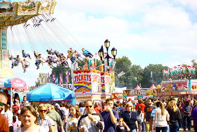Students and alumni check out the midway rides and games at the 2012 NC State Fair. The 2014 State Fair will feature several new foods, including deep-fried banana&#8217;s Foster and deep-fried rice krispies.&#160;