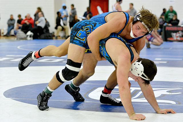 Sophomore Max Rohskopf grapples with opponent Garrett Peppelman (UVA-UNA) during the Wolfpack Open Sunday morning at Carmichael Gymnasium. Rohskopf finished eighth overall within the 165-pound weight class.