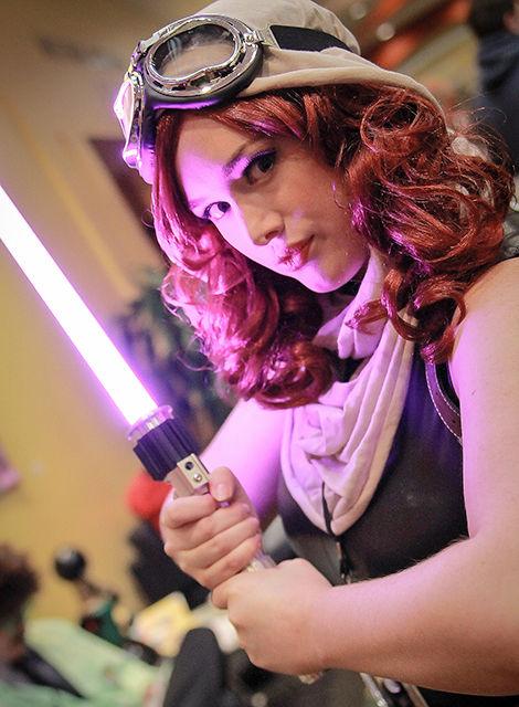 A ComiCon attendee poses with a lightsaber at the fifth annual NC ComiCon in Durham this weekend.