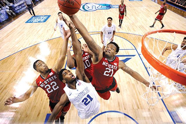 Sophomore forward Beejay Anya competes for a rebound with junior forward Amile Jefferson of Duke during the quarterfinal game of the ACC Tournament at the Greensboro Coliseum in Greensboro, Thursday, Mar. 12, 2015. The No. 2 Blue Devils crushed the Wolfpack, 77-53.