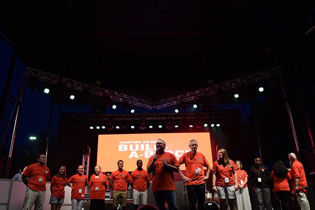 Chancellor Randy Woodson announces the Build-A-Block partnership with Habitat for Humanity Wake County during the 2015 Packapalooza festival. NC State pledged to build 11 homes on Lake Wheeler Road in Raleigh to raise awareness and address the need for affordable housing in Wake County.