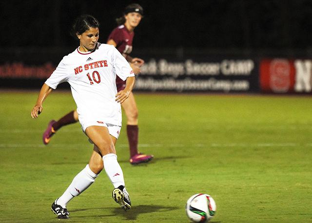 Redshirt sophomore midfielder Jackie Stengel passes the ball during Thursday's game against Elon. NC State defeated the Phoenix 2-0 at Dail Soccer Stadium.