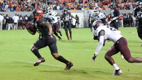 Sophomore tight end / full back Jaylen Samuels helps the wolfpack dominate over Eastern Kentucky as he rushes downfield with his 88 yards received. NC State won 35-0 at Cater-Finley Stadium on September 12th.