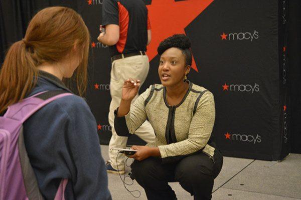 April Clark takes time after the fashion show to give a student extra tips on how to dress professionally. Career Development Center hosted the Macy's Fashion Show held in Talley Coastal Ballroom on Sept. 14th. Clark gave students the opportunity to learn how to dress more professionally.