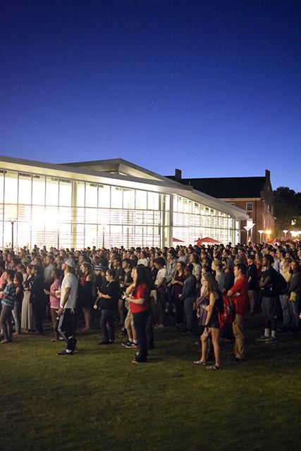A crowd gathers in the Stafford Commons Tuesday night for the candlelit vigil held in honor of freshman Joseph Alexander Banks. About 1,300 people joined together for the vigil. Various members of the NC State community spoke, including Student Body President Khari Cyrus.