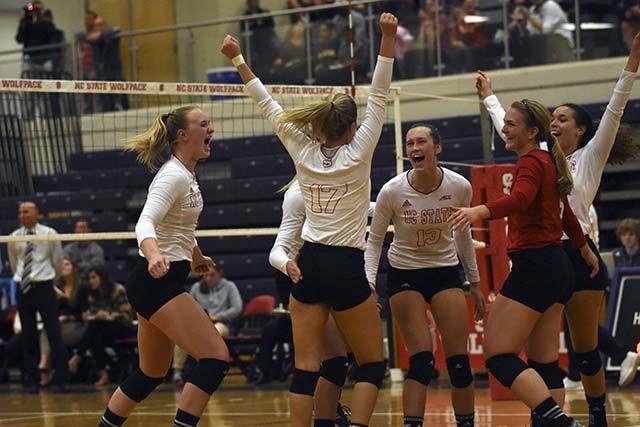 The Wolfpack volleyball team celebrates after winning a point against Wake Forest on October 2nd at Broughton High School. The Wolfpack took down Wake Forest 3-1 with a team total of 60 kills, 57 digs, and 14 blocks.