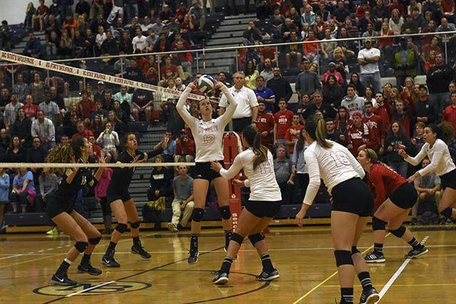 Junior setter Maggie Speaks sets up Freshman middle blocker Blayke Hranicka for a spike against Wake Forest. Speaks led the Woflpack on October 2nd at Broughton High School with 50 assists while Hranicka led with 17 kills. The Wolfpack won 3-1 against Wake Forest in front of a crowd of nearly 900.