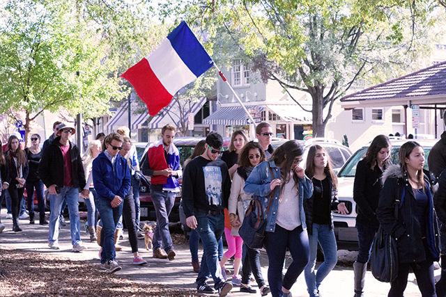 NC State students carry the French flag to show support for those affected by the attacks in Paris on Friday. &#160; &#160;