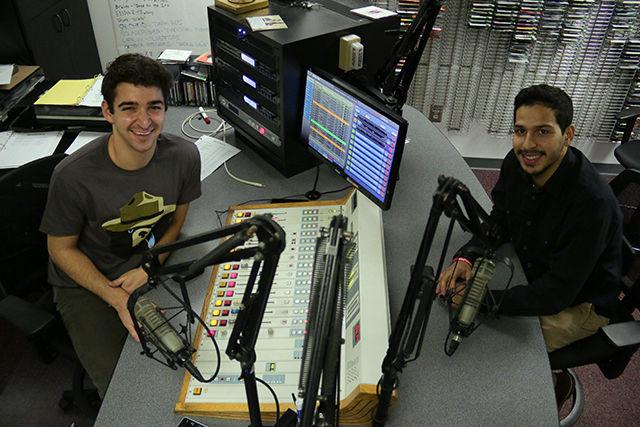 Marc Celestini, a senior studying electrical and computer engineering, and Diego Cancel, a senior studying environmental technology, run the mixing boards in NC State&#8217;s student-run radio station, WKNC 88.1 FM for their program. Cancel started the radio show in March of 2014 which, after a series of name changes, is now known as &#8220;Canto de Lobos.&#8221; Celestini joined soon after as a way to improve his Spanish speaking abilities.