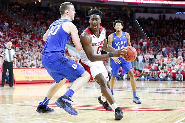 Abdul-Malik Abu drives and looks to pass into the paint in the second half of the game versus Duke. Abu finished the game with 14 points, 5 rebounds, two assists, one block, and one steal. NC State lost to the Duke Blue Devils 88-78 at PNC Arena on January 23, 2015.