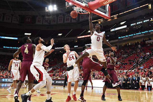 Sophomore forward Abdul-Malik Abu dunks the ball late in the game in the Wolfpack's 78-85 loss to Florida State on January 13, 2016. Abu made 21 points, grabbed 13 total rebounds, and had 6 assists in the loss at PNC Arena.