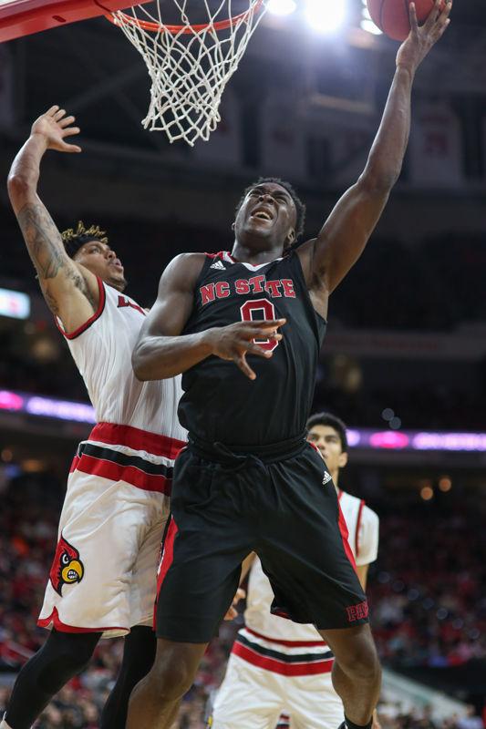 Sophomore forward Abdul-Malik Abu grimaces as he goes up for a layup against the Louisville defense. Abu had his fourth double double in the last five games during the 77-72 loss to Louisville on January 7th in PNC Arena.