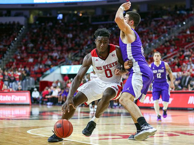 Sophomore Abdul-Malik Abu pushes past the High Point defense during the 76-73 buzzer-beating thriller over High Point University in PNC Arena Dec. 16.