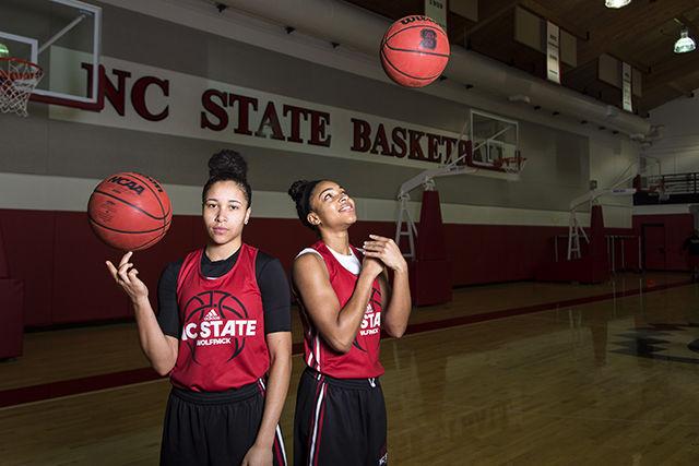 Junior guard Miah Spencer and redshirt junior guard Dominique Wilson pose for a picture before practice. The pair both passed 1,000 points scored this season with double digit point averages, of 13.8 and 15.6 points respectively, this season while leading the Wolfpack to a 19-10 season.