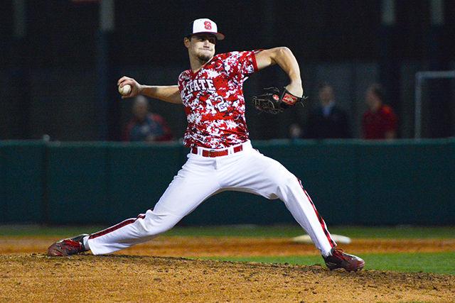 Sophomore pitcher Tommy Dejuneas pitches the ball. The NC State men's baseball team beat UNC-Greensboro 8-4 at Doak field in Dail Park on March 1.
