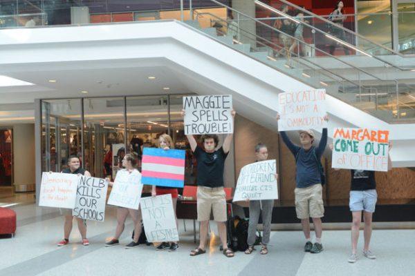 Various NC State students hold signs in silence to protest Margaret Spellings's visit to NC State's campus on Wednesday, April 20th. Protesters gathered on Stafford Commons and then in the lobby of Talley Student Union to show their opposition to Spellings taking the position of president of the UNC public university system.