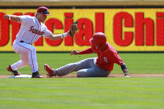 Sophomore shortstop Joe Dunand slides into second base and beats the tag during the first game in the ACC Championship Tournament against Florida State on May 25. Dunand had one run, one walk and one hit in three at bats in the 7-3 loss at the Durham Bulls Athletic Park. After being ahead 3-1 for the first four innings, the Wolfpack gave up two runs in the sixth inning and four runs in the eighth inning to let the Seminoles take the lead.