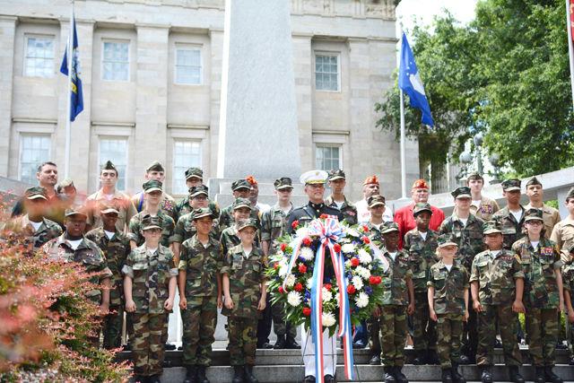 Capitol City Young Marines pose with Lieutenant General Robert R. Ruark of the US Marine Corps during Monday's Memorial Day wreath-laying ceremony held at the State Capitol Building.