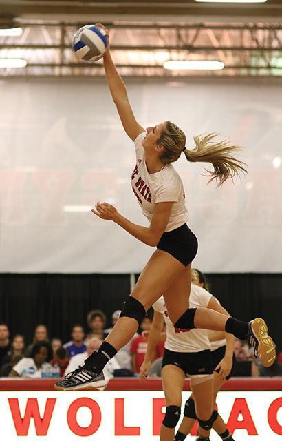 Then-sophomore middle blocker Kaitlyn Kearney goes up for a kill against Campbell on Sept.18, 2015. Kearney led the Pack with 16 kills in the 3-0 dominant win in Carmichael gymnasium in front of 844 fans.