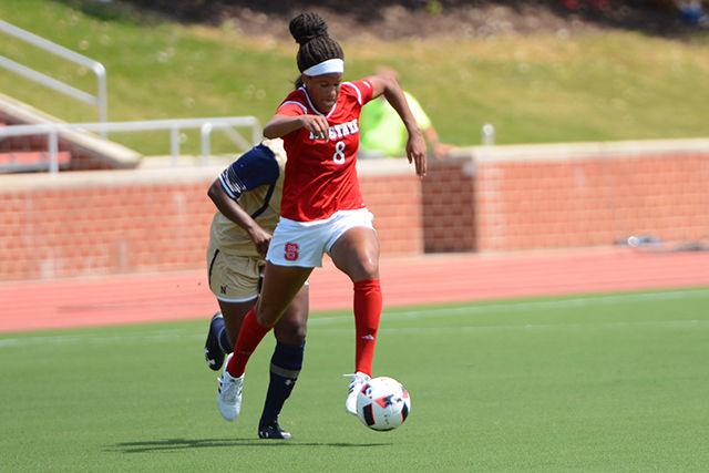 Freshman forward Kia Rankin sprints while dribbling the ball ahead of a Navy player. The Wolfpack beat Navy 4-1 at Dail Soccer Stadium on Aug. 28.
