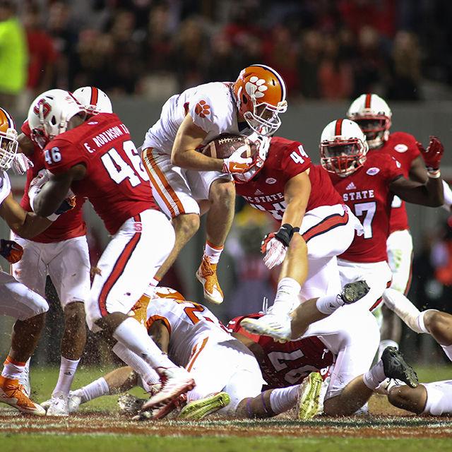 A Clemson player jumps through the air to return an NC State onside kick. The Wolfpack special teams had an amazing day holding No. 3 Clemson to zero yards on punt returns and outrunning Clemson on kickoff returns 35.5 to 22.8 during the homecoming game. The Wolfpack lost to the Tigers 56-41 on Oct. 31 in Carter-Finley Stadium.