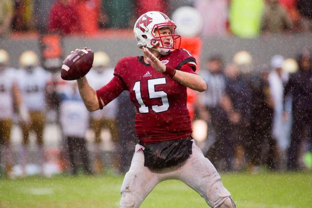 Redshirt sophomore Ryan Finley prepares to throw the ball in extreme weather as Hurricane Matthew bores down. Despite the weather, Finley completed nearly 50 percent of his passes, though only for 27 yards. The Wolfpack outrushed Notre Dame 157-59 for a 10-3 win on Oct. 8 in Carter-Finley Stadium.