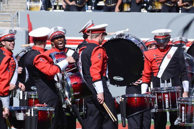 RJ Harper, an NC State band member, laughs along his friends in the Carter-Finley Stadium before the football game against Wake Forest on Oct. 1, 2016.