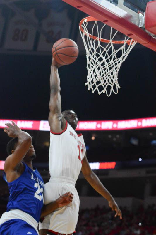 Freshman guard Markell Johnson dunks on Chances Matlock from Lynn University. Johnson had a good first match with seven total points and several assists to his teammates. The Wolfpack had a great first exhibition match with a winning score of 100-66 in PNC Arena on Thursday.