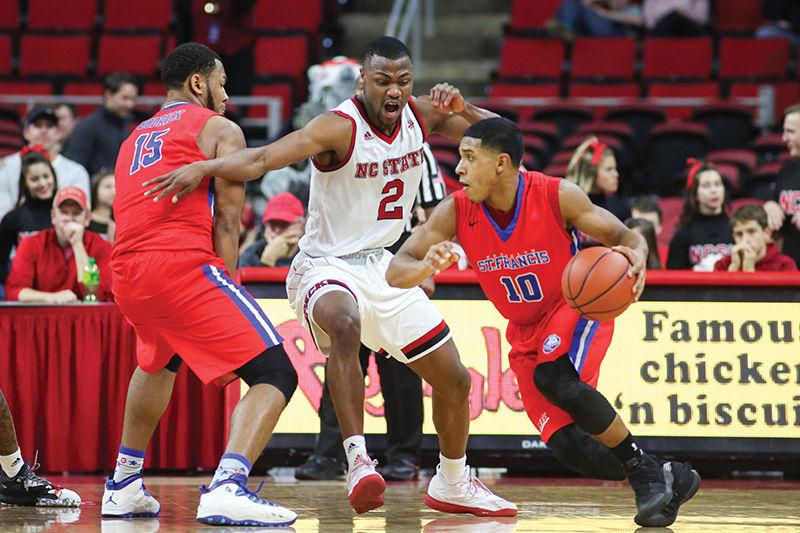 Redshirt sophomore Torin Dorn moves around the screen on defense during the 86-61 win over St. Francis College in PNC Arena Sunday.