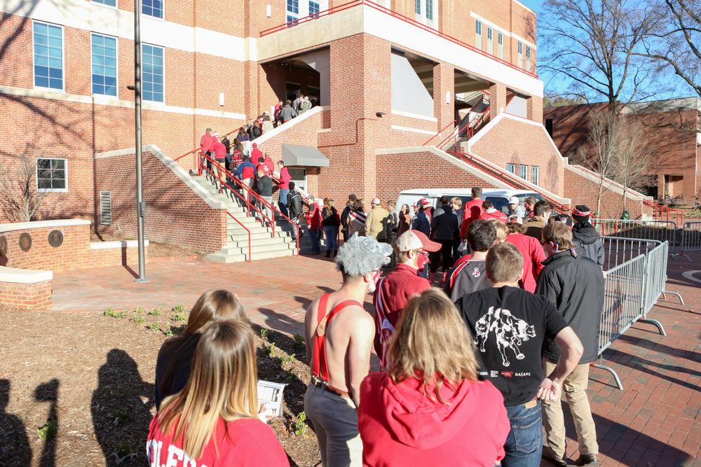 Students line up to enter the game before the 67-55 overtime win over Tennessee State in Reynolds Coliseum on Dec. 10, 2016.