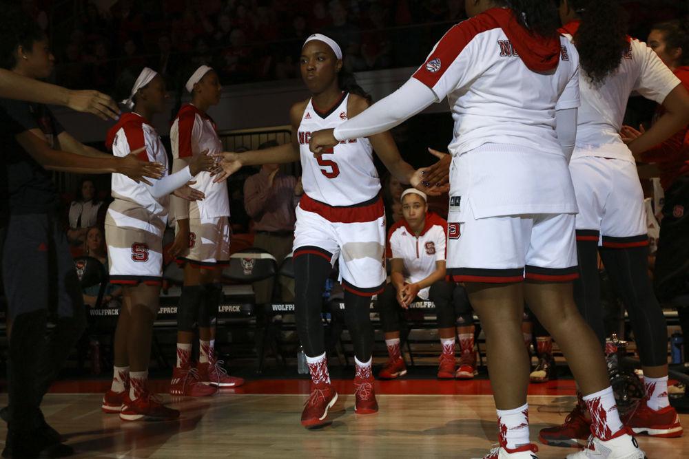 Junior forward Chelsea Nelson gets high fives from teammates as the is introduced before the Wolfpack's game against Clemson on Jan 22. The Wolfpack held on to beat the Tigers 65-53 at Reynolds Coliseum.