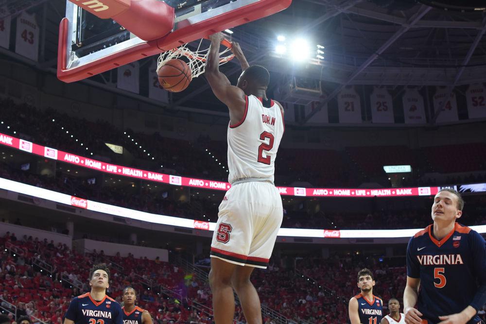 Redshirt sophomore Torin Dorn dunks after a fast break against Virginia in PNC Arena on Feb. 25. Dorn had nine rebounds during the game, but the Pack was defeated 70-55.