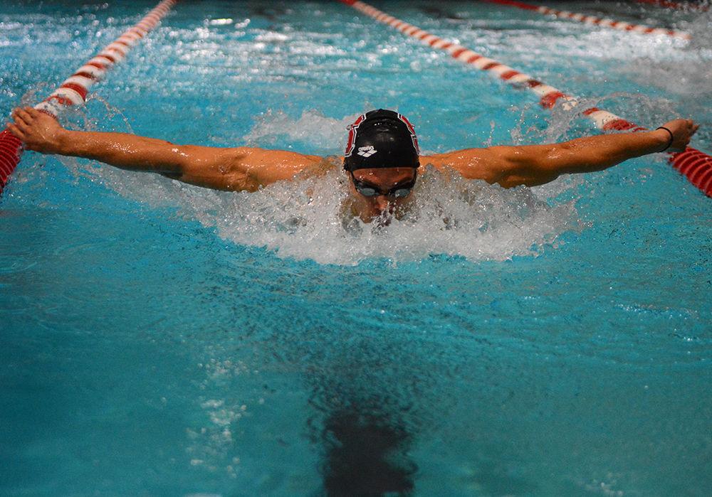 Junior Andreas Vazaios swims in the 200-yard butterfly against UNC-Chapel Hill at the Willis R. Casey Aquatic Center Jan. 27. Vazaios came in first in the 200-yard butterfly event with the time of 1 minute 45.18 seconds. The Wolfpack won the game against the Tar Heels, 176-69.