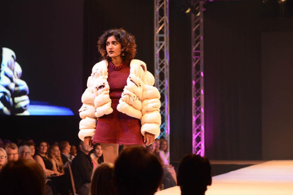 A model shows off a fur jacket created by Grace Bilbao, a junior studying art and design, as part of her collection called Quasi. Art 2 Wear, a fashion show created and executed by students in the College of Design, took place at Talley Student Union on April 28, 2017.