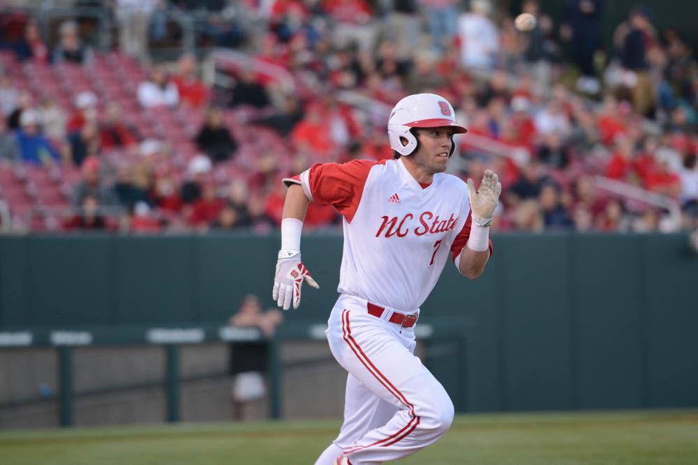 Junior outfielder Stephen Pitarra runs to first base on April 8, 2017 during the Wolfpack's game against Florida State. Pitarra had 1 run and 1 hit for four at bats. The Wolfpack won 8-4 at Doak Field.