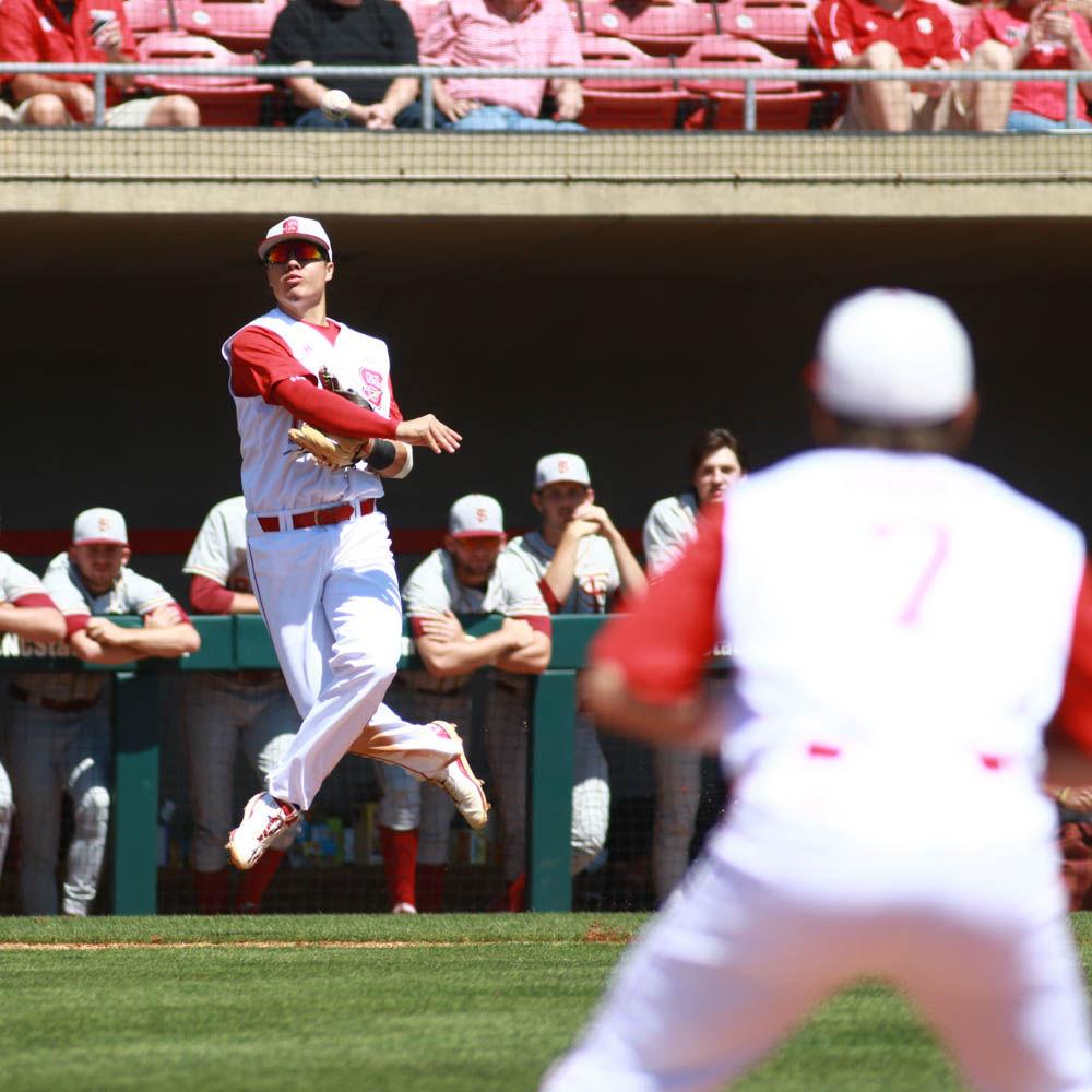 Junior third baseman Evan Mendoza throws the ball in stride to first base after fielding a ground ball in the Wolfpack's 8-4 win over Florida State on April 9, 2017 at Doak Field.