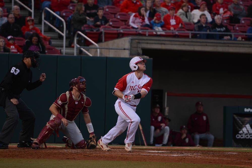 Freshmen center Brad Debo looks to see if he made a good hit on April 8, 2017 at the Wolfpack game against Florida State. Debo had 1 run at four at bats. Wolfpack won 8-4 to clinch the serieis against #22 FSU.