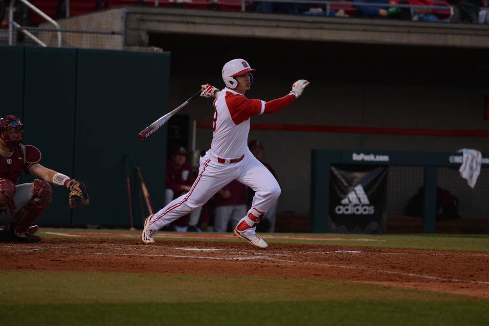 Junior infielder Evan Mendoza sprints to first base after hitting at the baseball game against Florida State on April 8, 2017. Wolfpack won 8-4 at Doak Field.
